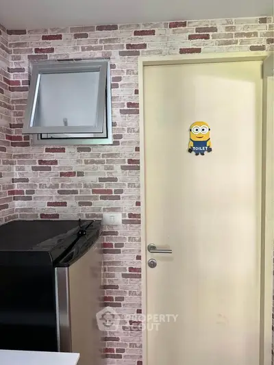 Charming interior with brick accent wall and modern appliances