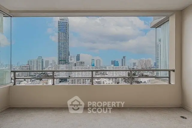 Stunning cityscape view from high-rise balcony with expansive skyline.