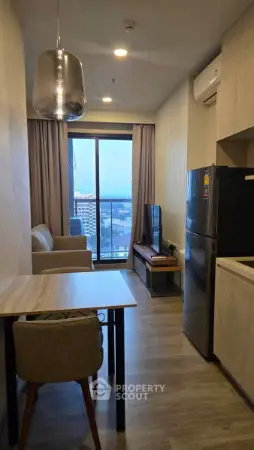 Modern apartment living room with city view, featuring sleek furniture and contemporary design.