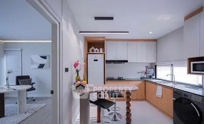 Modern kitchen with open layout and stylish dining area