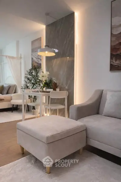Modern living room with stylish decor and cozy seating area, perfect for relaxation and entertaining.