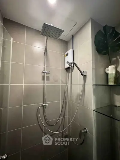 Modern bathroom shower with sleek fixtures and stylish tile design