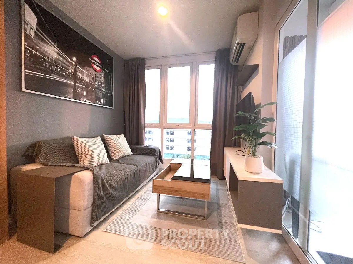 Modern living room with stylish decor and large windows