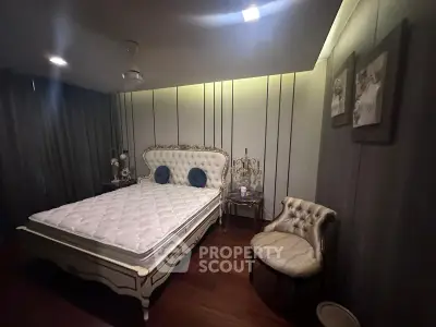 Luxurious bedroom with elegant decor and plush furnishings in a sophisticated setting.