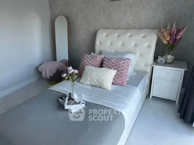 Elegant bedroom with plush decor and stylish accents, perfect for a cozy retreat.