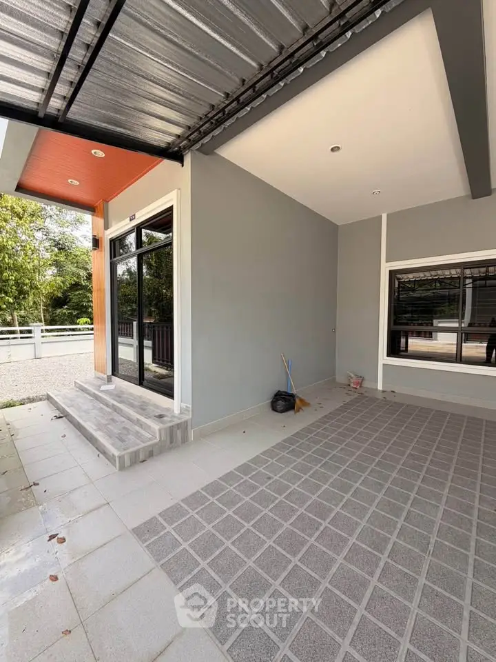 Modern house exterior with covered carport and stylish entrance