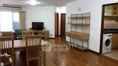 Spacious living room with dining area and modern appliances