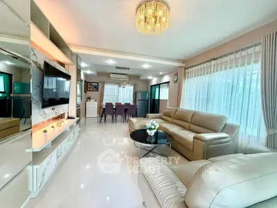Spacious modern living room with elegant decor and large windows for natural light.