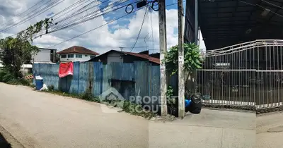 Spacious industrial property with gated entrance and ample outdoor space.