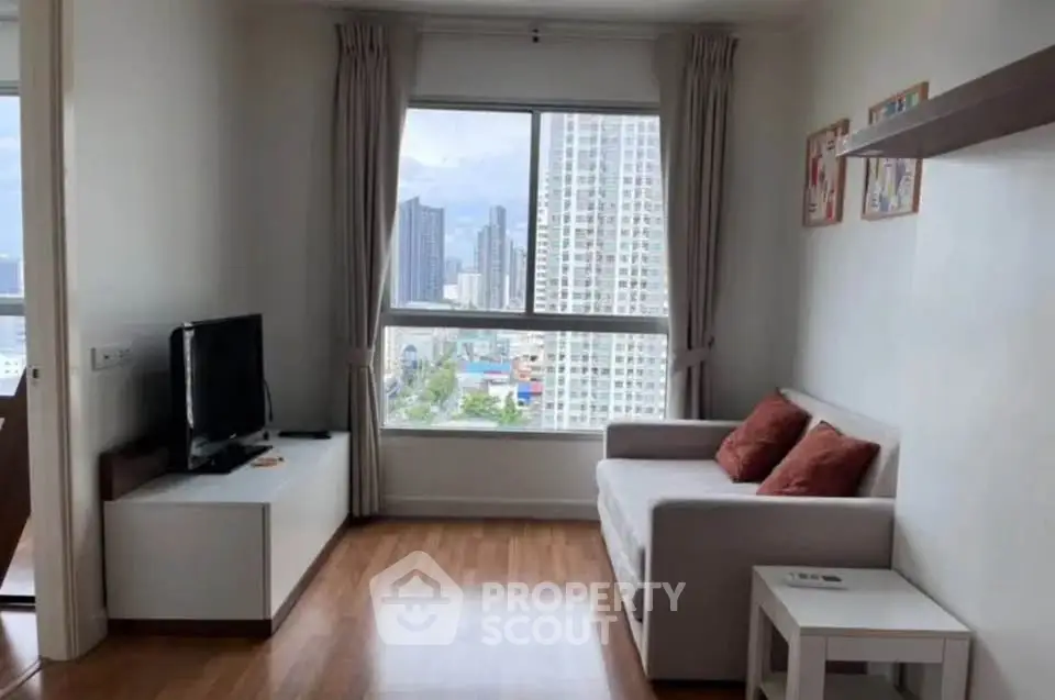 Modern living room with city view, featuring a cozy sofa and sleek TV stand, perfect for urban living.