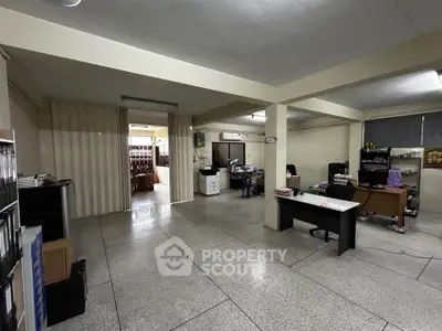 Spacious office space with open layout and modern furnishings, ideal for business operations.