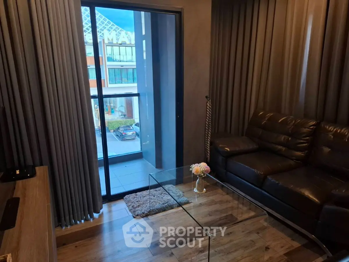 Cozy living room with modern decor and balcony view