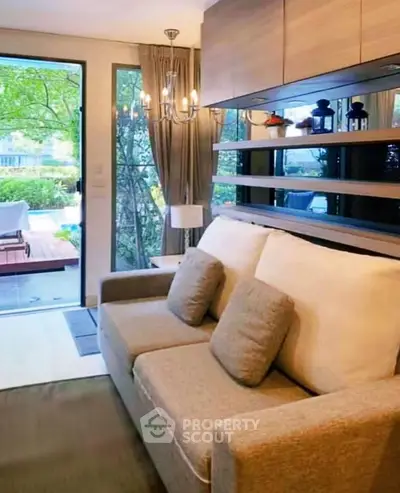 Cozy living room with elegant decor and garden view, perfect for relaxation.