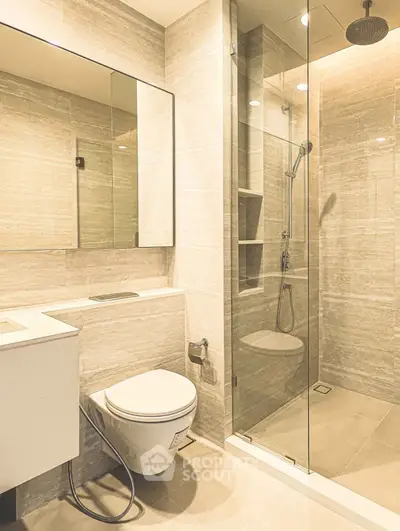 Modern bathroom with glass shower and sleek fixtures