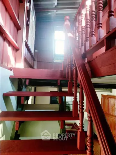 Charming wooden staircase with rustic design and natural light