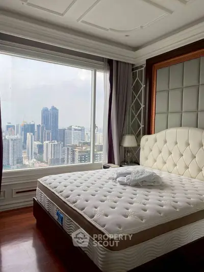 Luxurious bedroom with stunning city view from large window