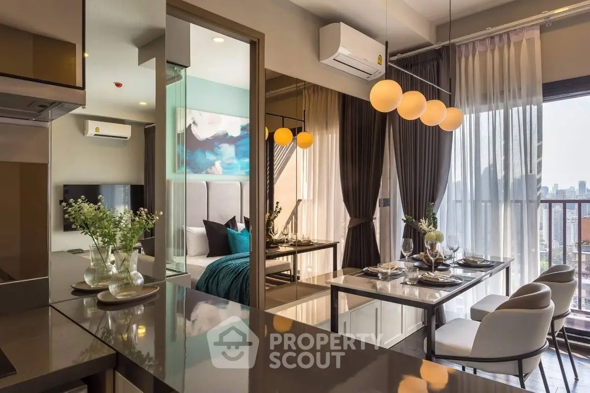 Modern open-plan living and dining area with city view, stylish decor, and elegant lighting.