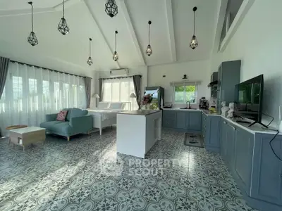 Spacious open-plan living room with elegant decor and natural light