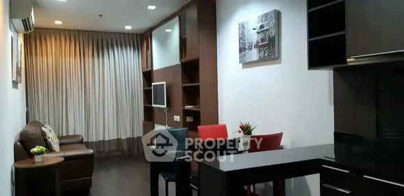 Modern living room with stylish furniture and open layout in a cozy apartment.