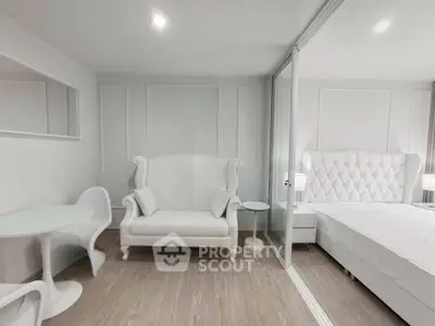 Elegant white bedroom with modern furniture and stylish decor
