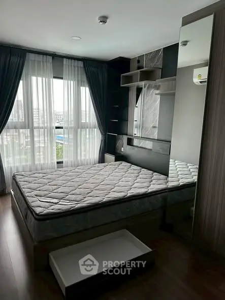 Modern bedroom with large windows and stylish decor