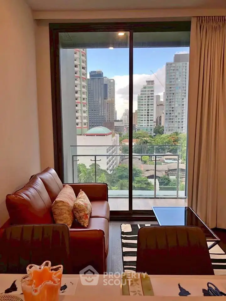 Modern living room with city view from balcony in high-rise apartment