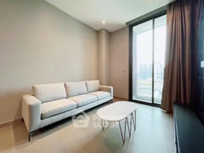 Modern living room with sleek sofa and large window offering city view