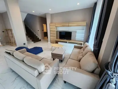 Spacious modern living room with elegant furniture and natural light