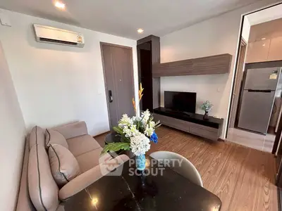 Modern living room with sleek furniture and stylish decor in a cozy apartment.