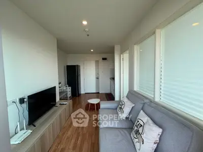 Modern living room with sleek furniture and wooden flooring