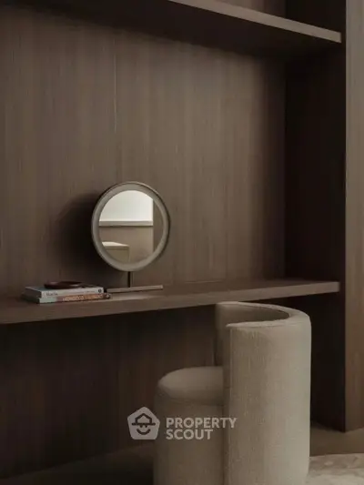 Elegant modern study nook with round mirror and plush chair in minimalist design.