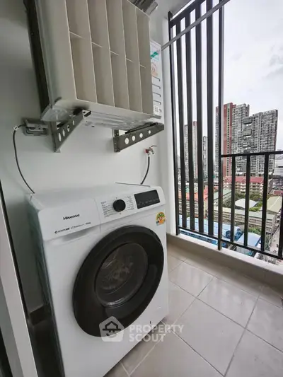Modern balcony with washing machine and city view, perfect for urban living.