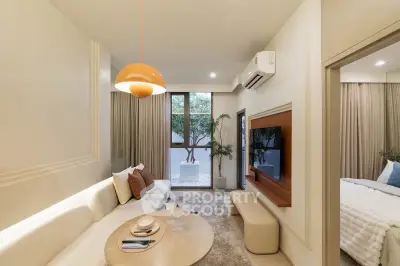 Modern living room with stylish decor and large window, adjacent to a cozy bedroom.
