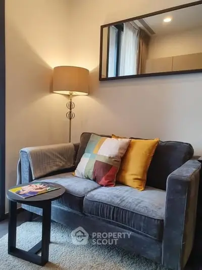 Cozy living room with plush sofa and stylish floor lamp