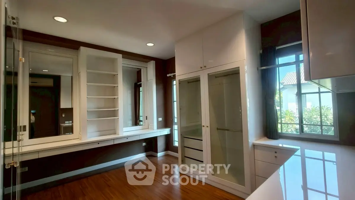 Spacious walk-in closet with ample storage and natural light