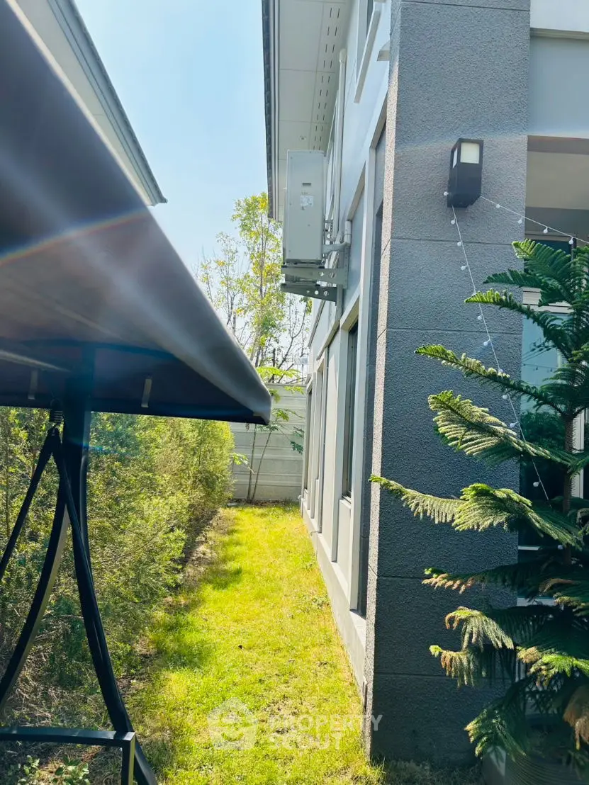 Modern exterior view with lush greenery and sleek architecture