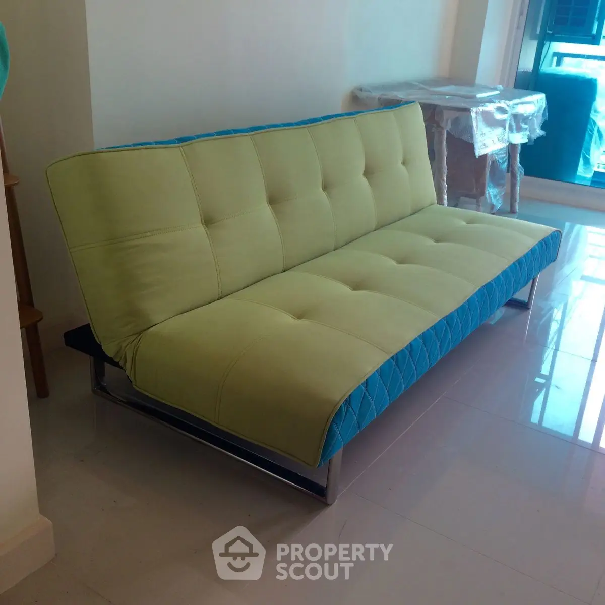 Modern living room with stylish sofa and glossy floor tiles