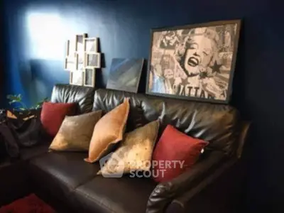 Stylish living room with leather sofa and modern art decor