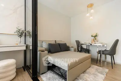 Modern living room with stylish dining area and cozy seating in elegant apartment.