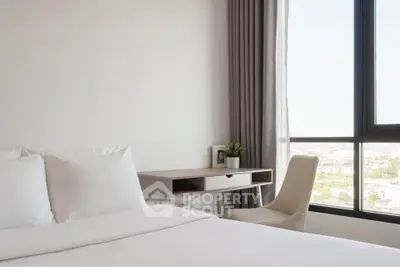 Bright bedroom with large window and modern desk, offering a serene city view.