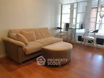 Modern living room with cozy sofa and stylish furniture in a bright apartment.