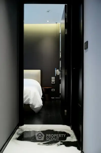 Luxurious modern bedroom entrance with sleek design and ambient lighting.