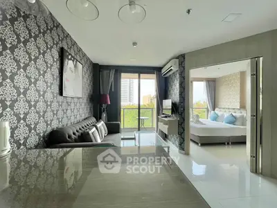 Modern open-plan living room with stylish decor and balcony view