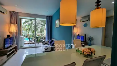 Chic living room with pool view and modern decor in tropical setting
