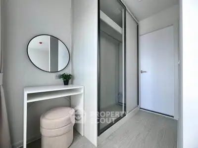 Modern minimalist bedroom with sleek wardrobe and vanity area