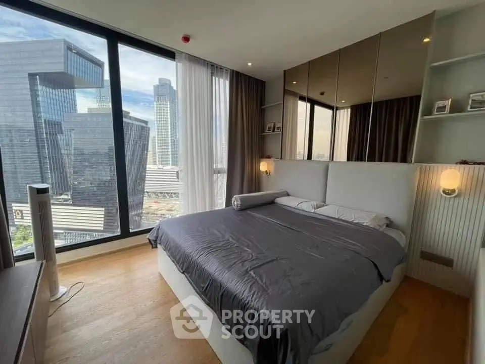 Luxurious bedroom with stunning city view and modern decor