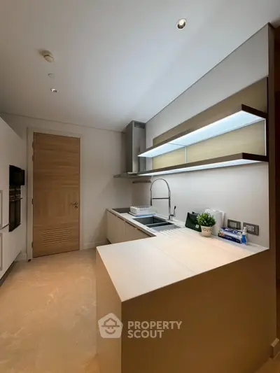 Modern kitchen with sleek design and open layout, featuring high-end appliances and stylish cabinetry.