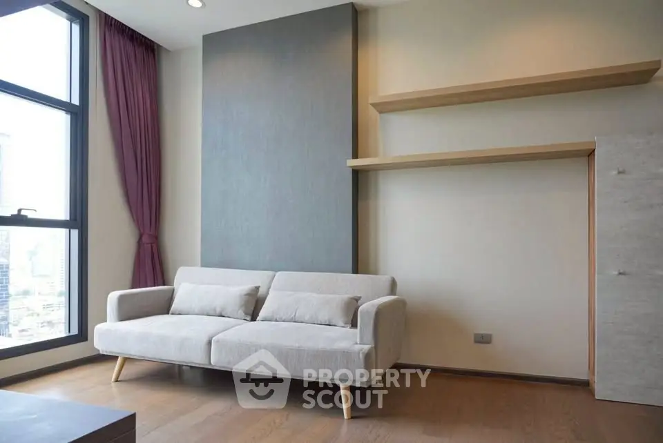 Modern living room with stylish sofa and large window view