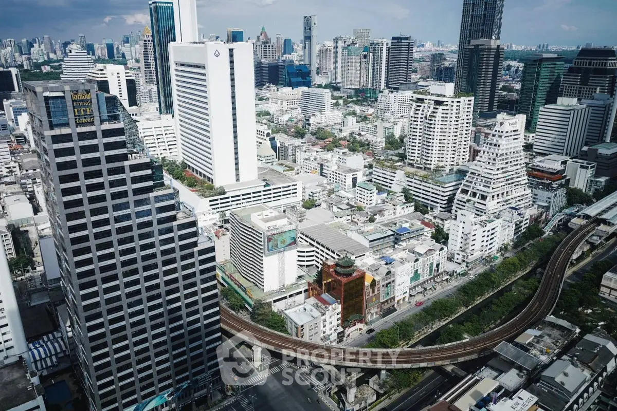 Stunning aerial view of modern cityscape with skyscrapers and urban skyline.