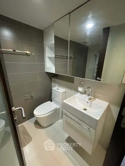 Modern bathroom with sleek fixtures and ample storage space